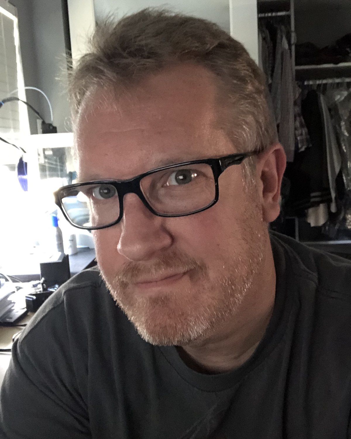 Portrait of Geoff Leavitt in dark-rimmed glasses