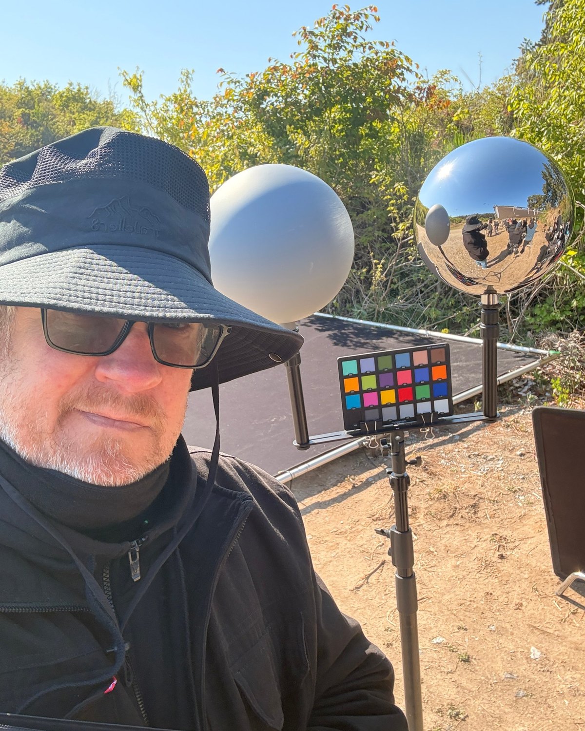 Geoff Leavitt on set beside a chrome ball, gray ball and color chart