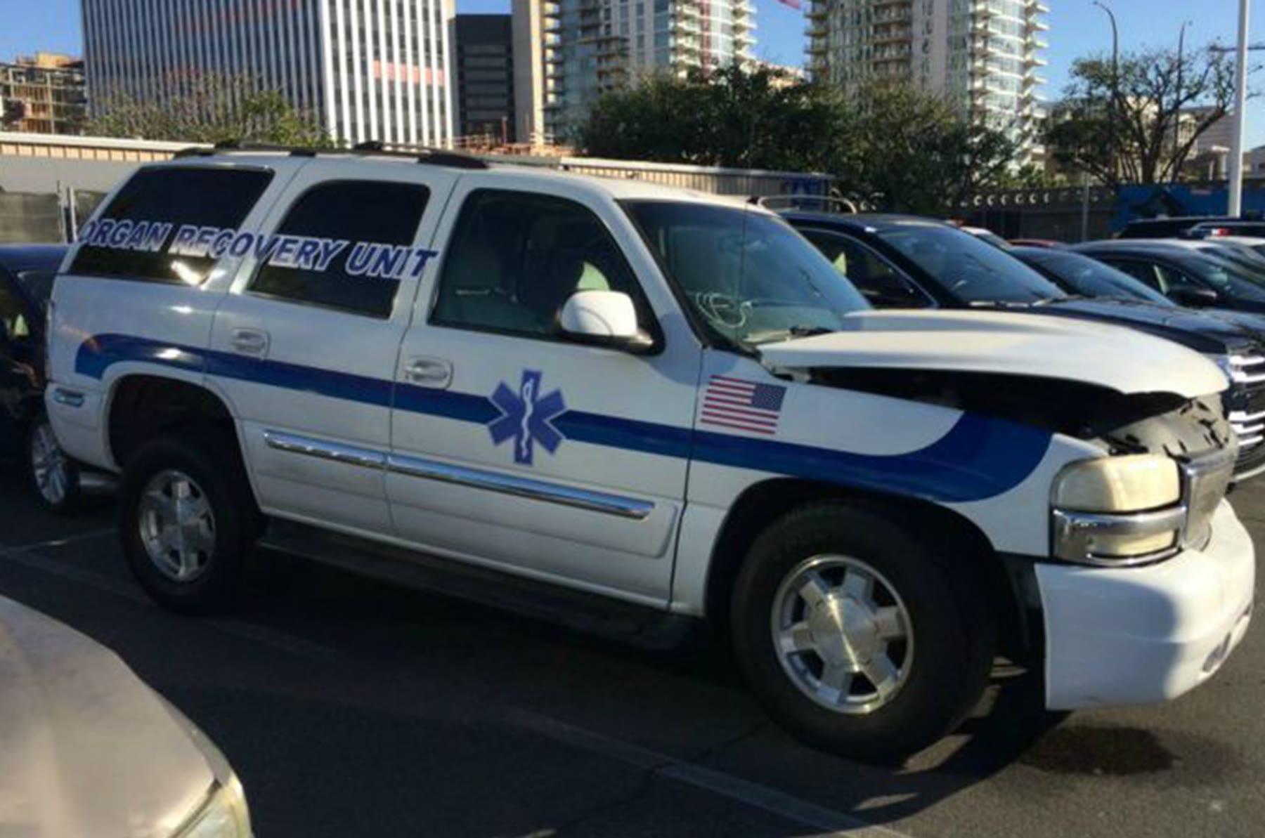 White EMS SUV with blue stripes