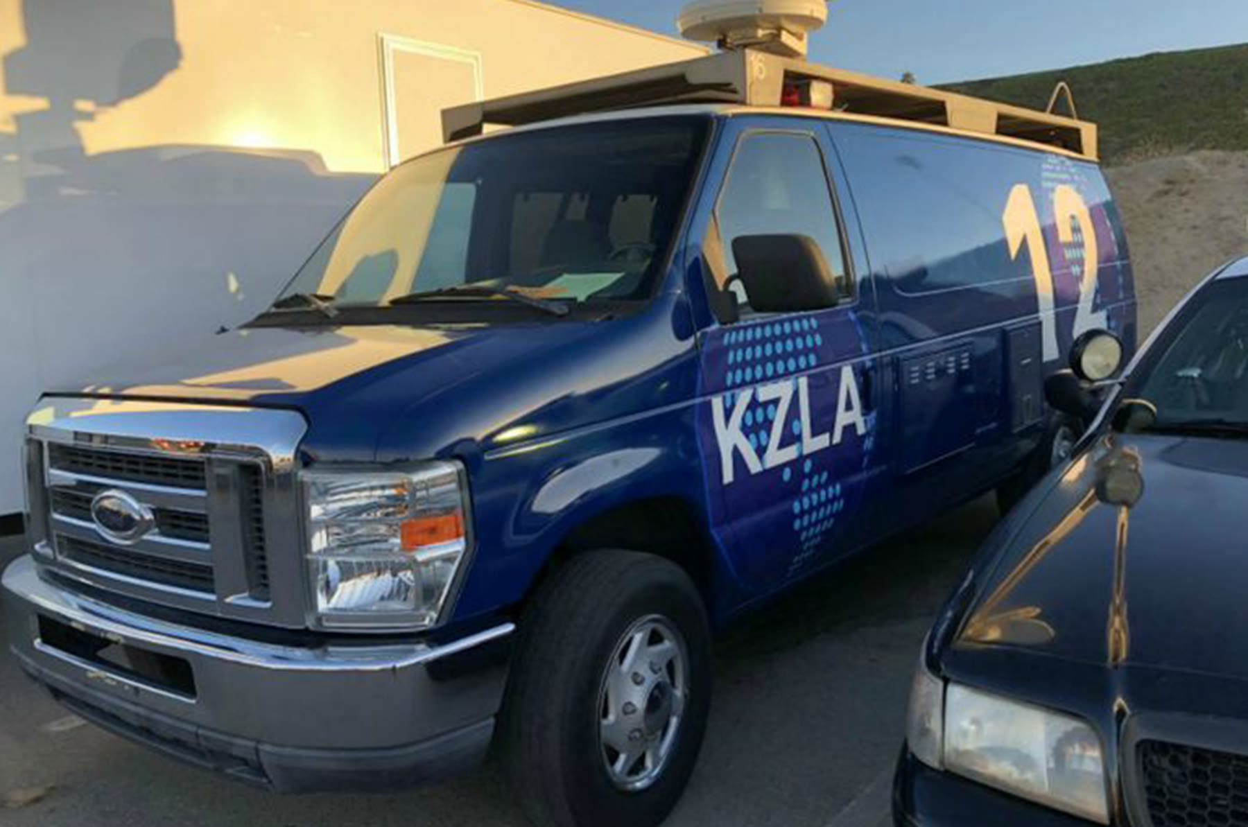 Blue KZLA news van