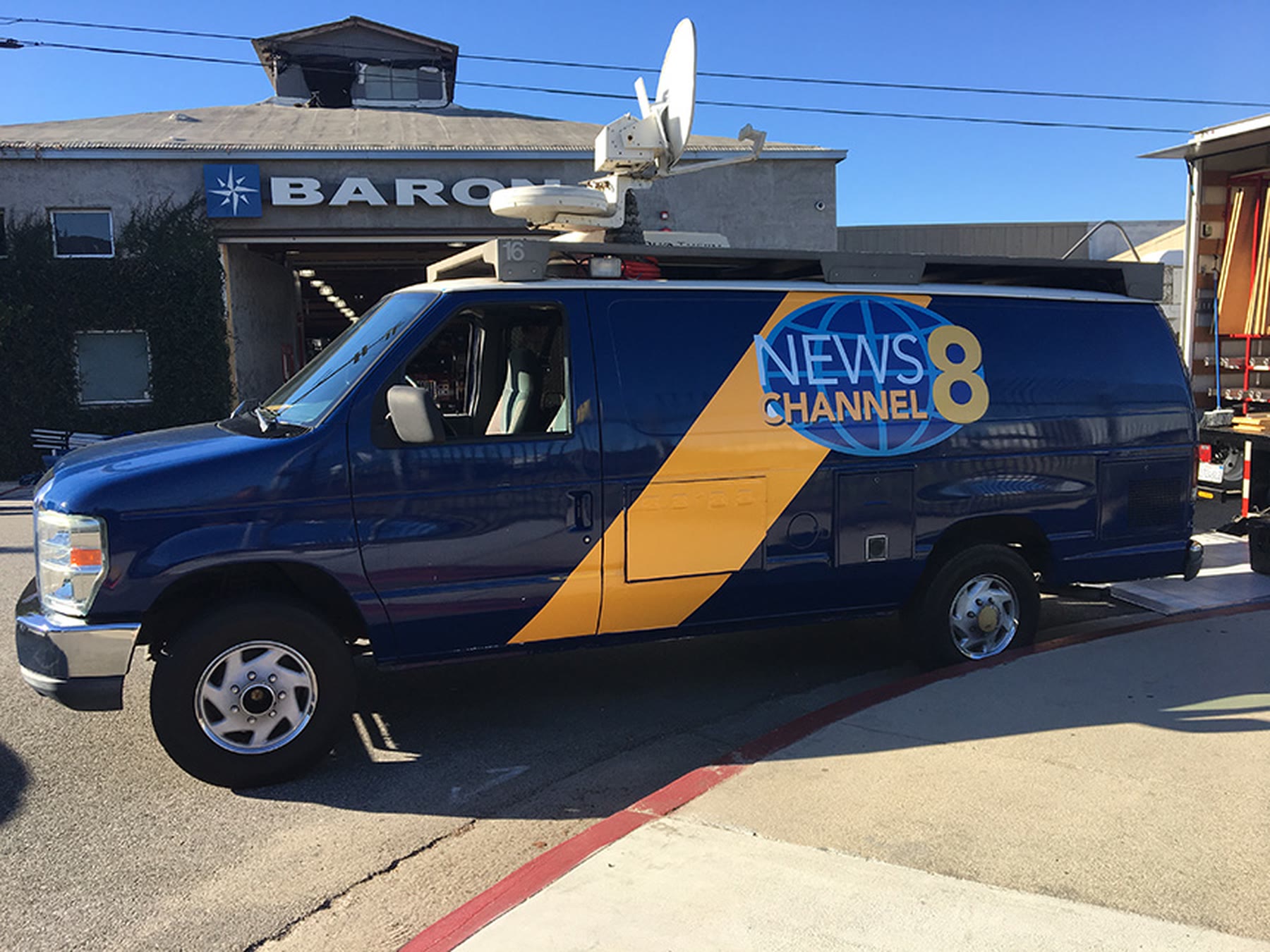 Blue News Channel 8 satellite van