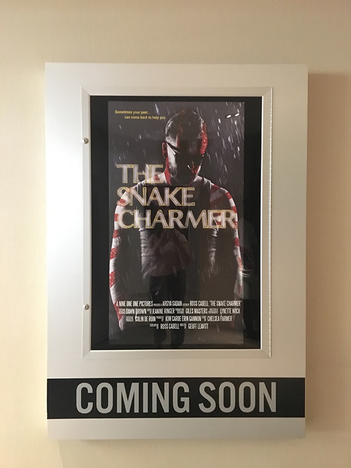 Coming soon poster in a frame