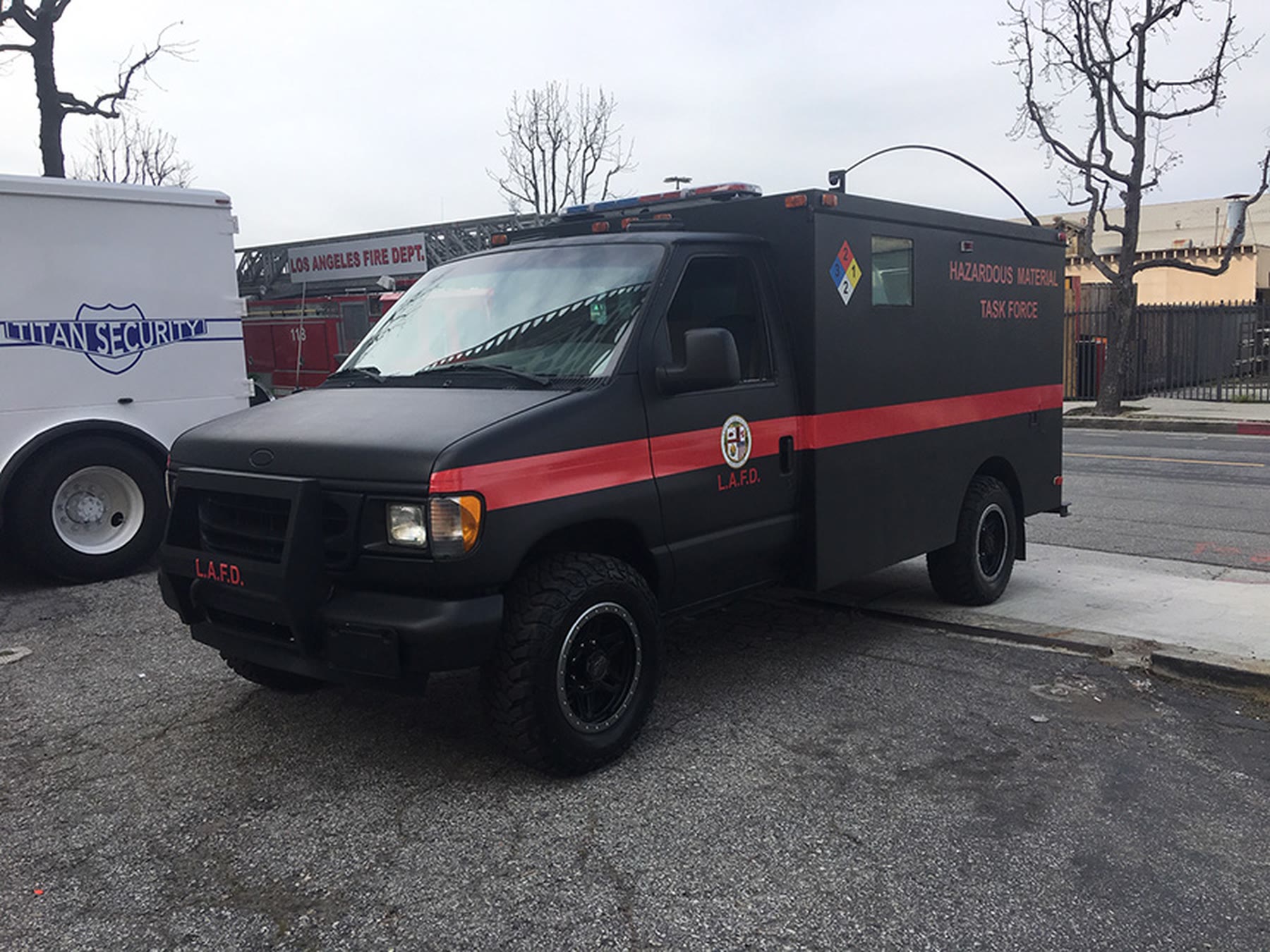 Black van with a red stripe